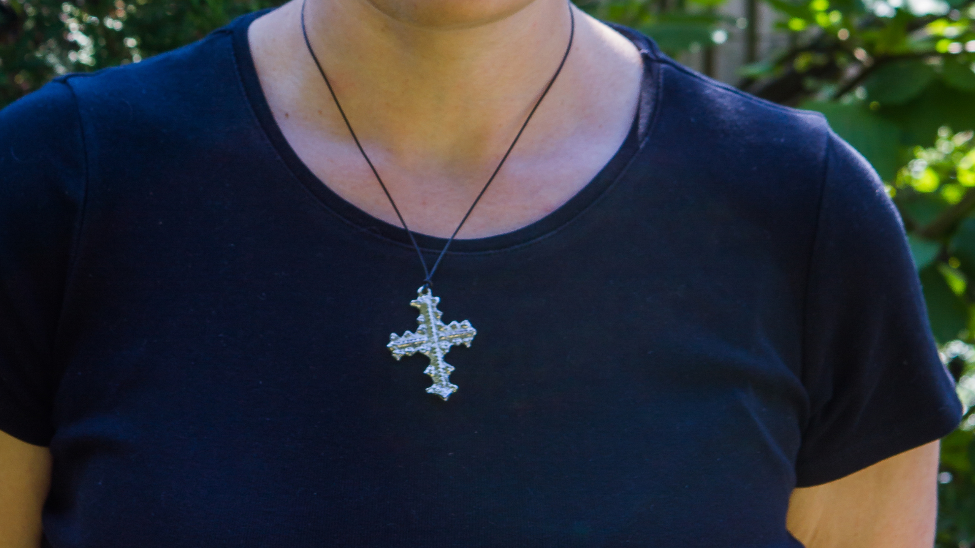 A close up of the silver cross Anna will wear.