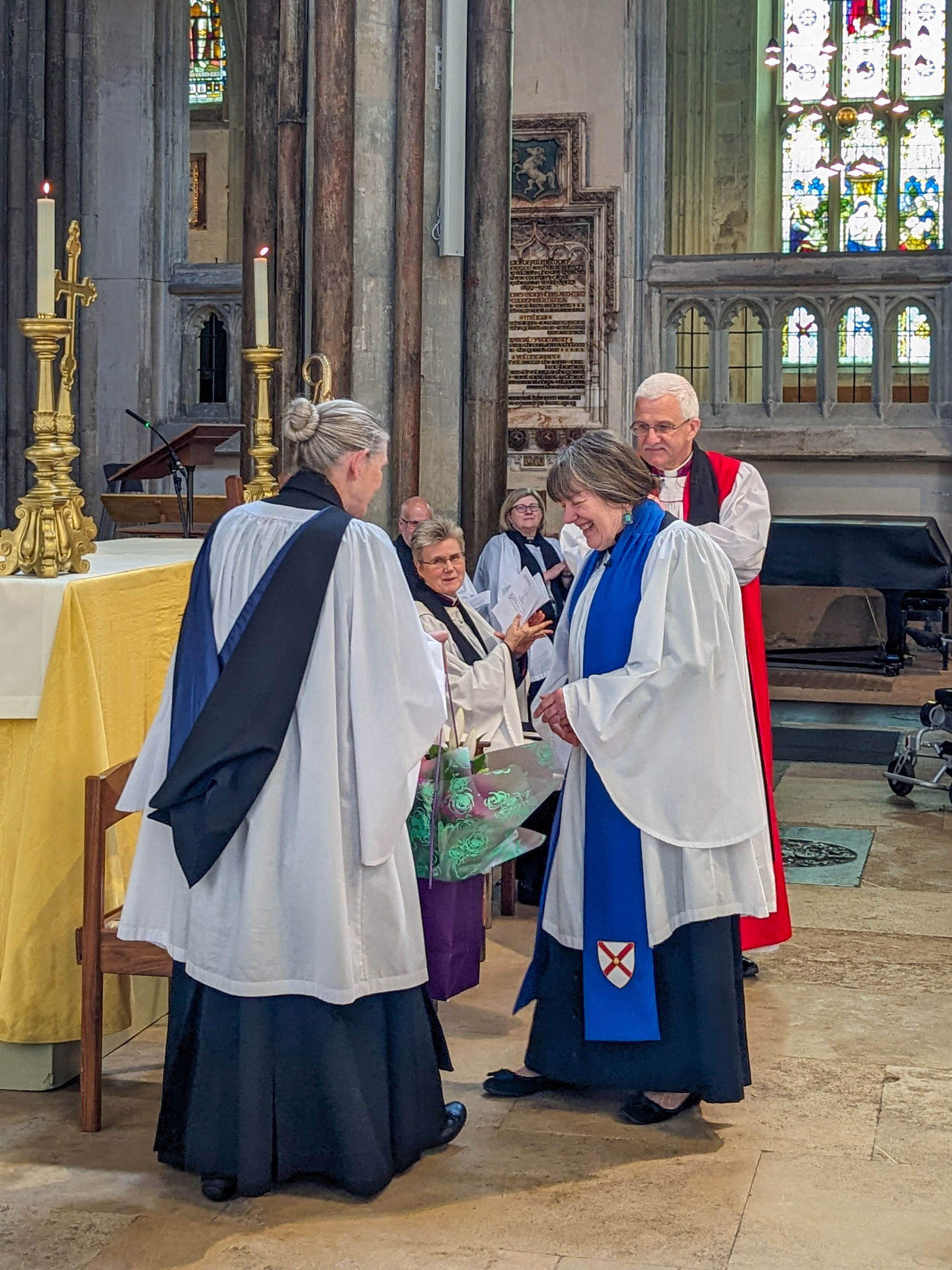 Karen Senior is presented with flowers and a card