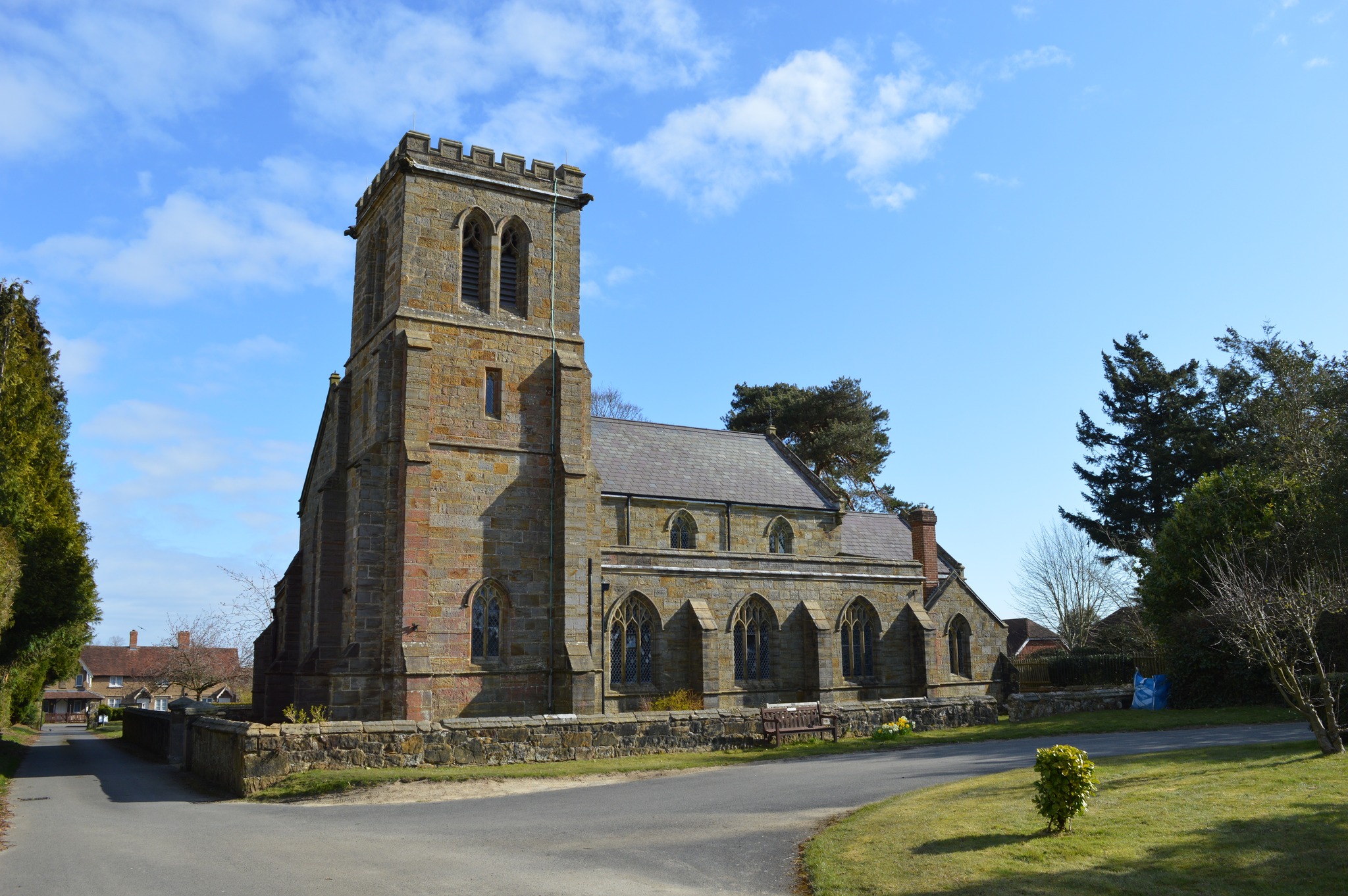 St Peter's Church Pembury sits proudly under a bright blue sky.