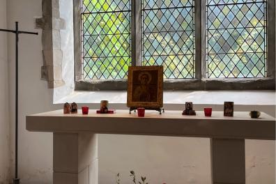 Praying with icons crop (396 x 264 px).png