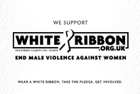 ..The logo for the White Ribbon campaign which consists of words and a looped ribbon in black and white