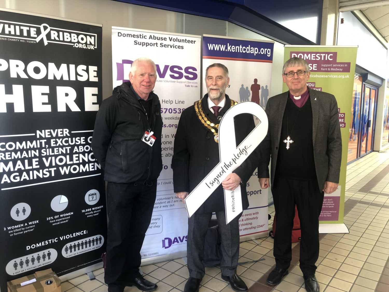 Bishop Simon joins Keith Berry, (Community Engagement Officer at the Diocese of Rochester), and The Mayor of Tonbridge Cllr Roger Roud at an event on Tonbridge High Street, They hold a big white ribbon to reflect the White Ribbon campaign,
