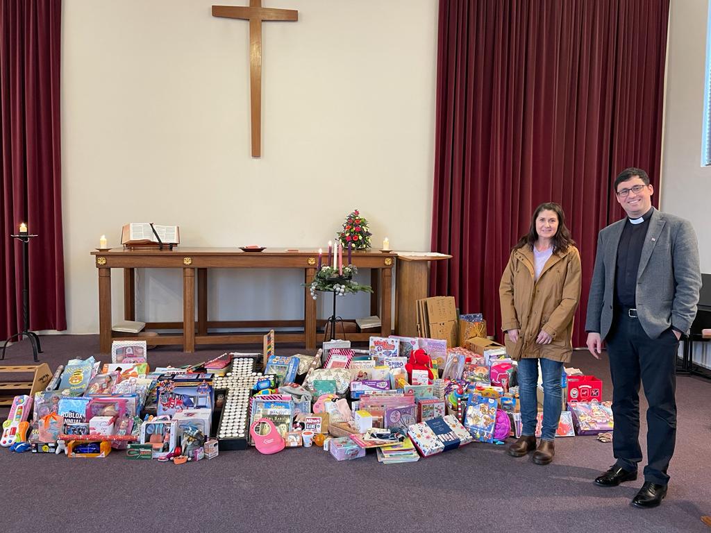 Clair from Bexley Women's Aid and Rev Mark with gifts from Bishop Ridley Church service