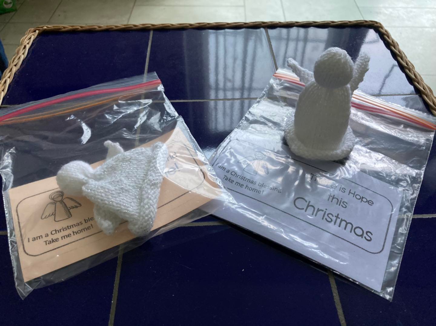 Knitted angels displayed on a table