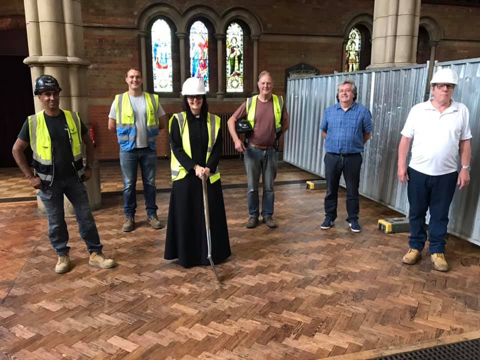 Vicar Cathy Knight Scott with builders at St John's Sidcup