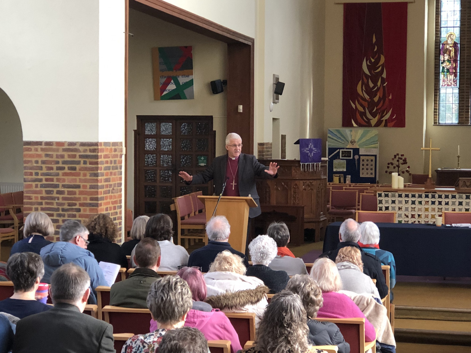 Bishop Jonathan stands at a lectern and address Diocesan Synod